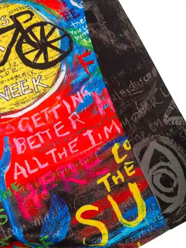 Colorful cycling jersey with bold graffiti-style graphics and motivational text for men and women riders