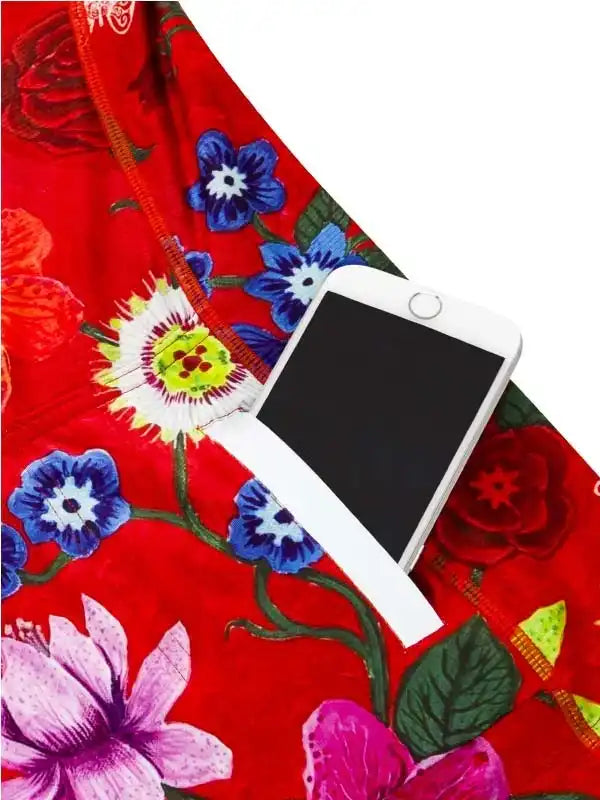 Red floral cycling jersey with phone pocket, vibrant blue and pink flowers, ideal for women's bike wear