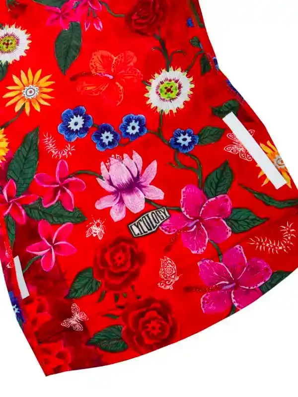 Vibrant red cycling shorts with floral print, featuring pink, blue, and yellow flowers, green leaves, and reflective strips for safety.