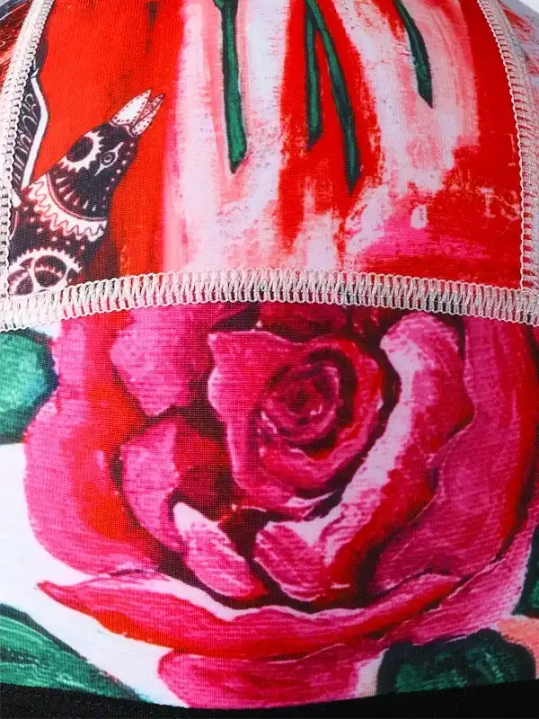 Vibrant red rose and bird print cycling jersey with detailed stitching