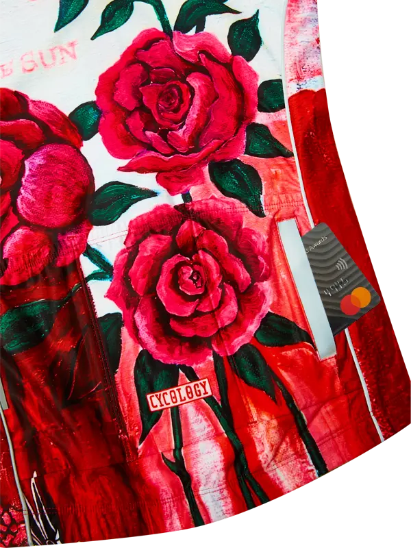 Cycling jersey with long sleeves and a red rose pattern and brand logo on a white background