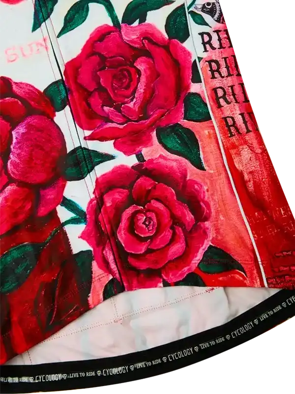 Vibrant red rose print cycling shorts with green leaves and bold text design, ideal for women's bike wear.