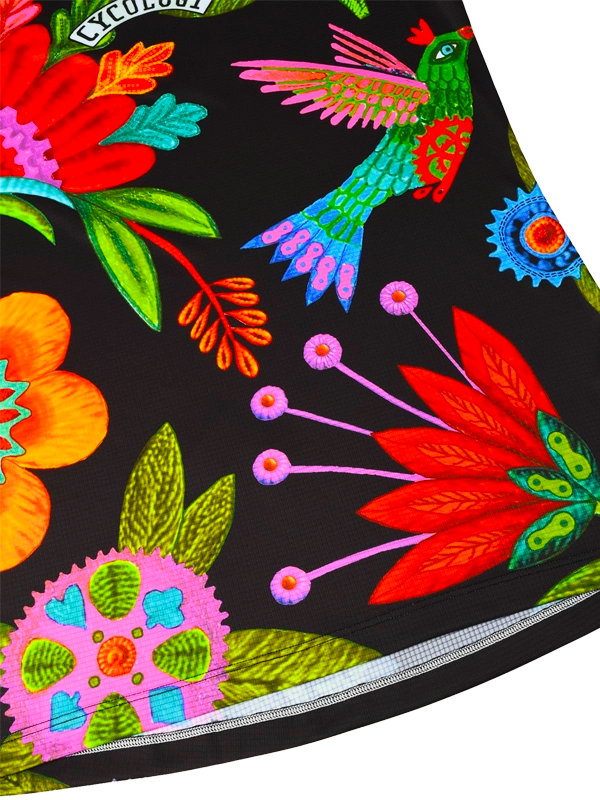 Vibrant floral and hummingbird print on black cycling shorts with zipper pocket