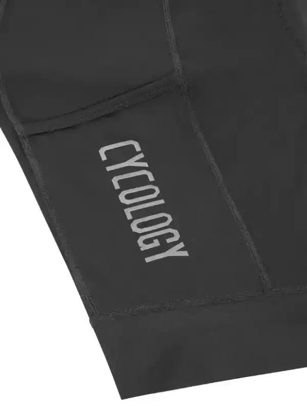 Black cycling shorts with 'CYCOLOGY' logo, high-quality fabric for men's and women's bike wear