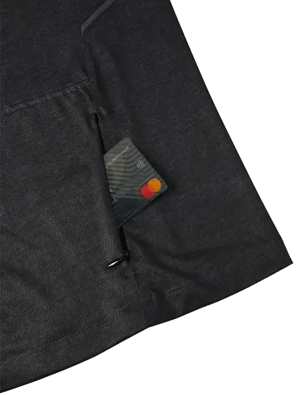 Black cycling jersey pocket holding credit card, showcasing secure storage for rides