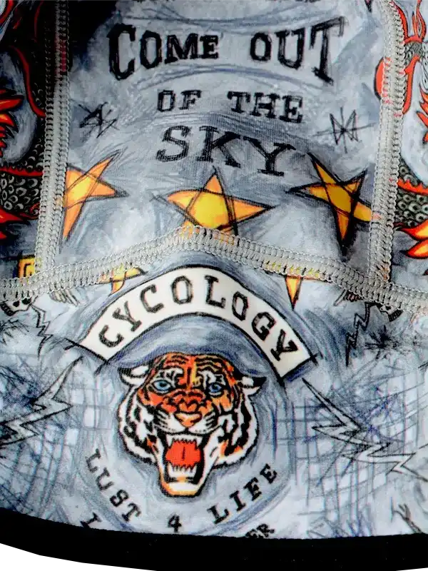 Cycling jersey with tiger graphic, stars, and 'Come Out of the Sky' text on gray fabric