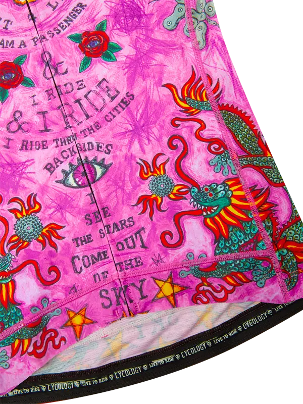 Colorful fabric with dragon designs and text on a pink background