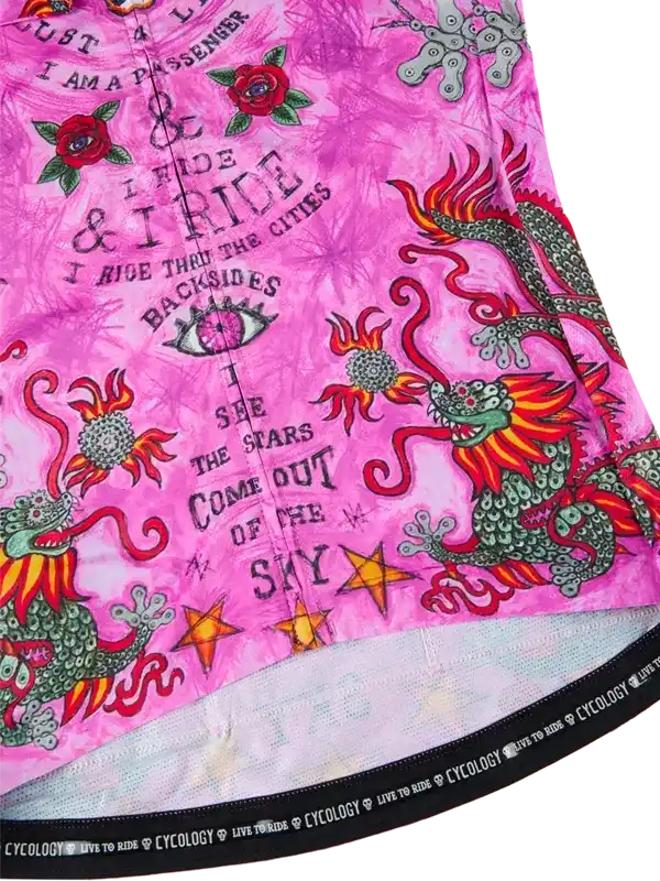 Pink cycling jersey with dragon and rose designs, featuring bold text and vibrant patterns for riders.