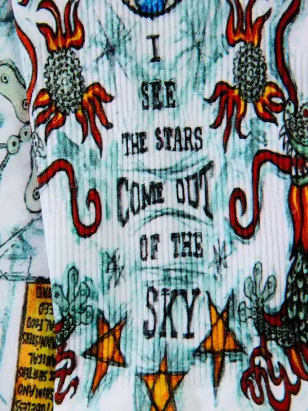 Cycling jersey with 'I see the stars come out of the sky' text, vibrant flames, and star designs