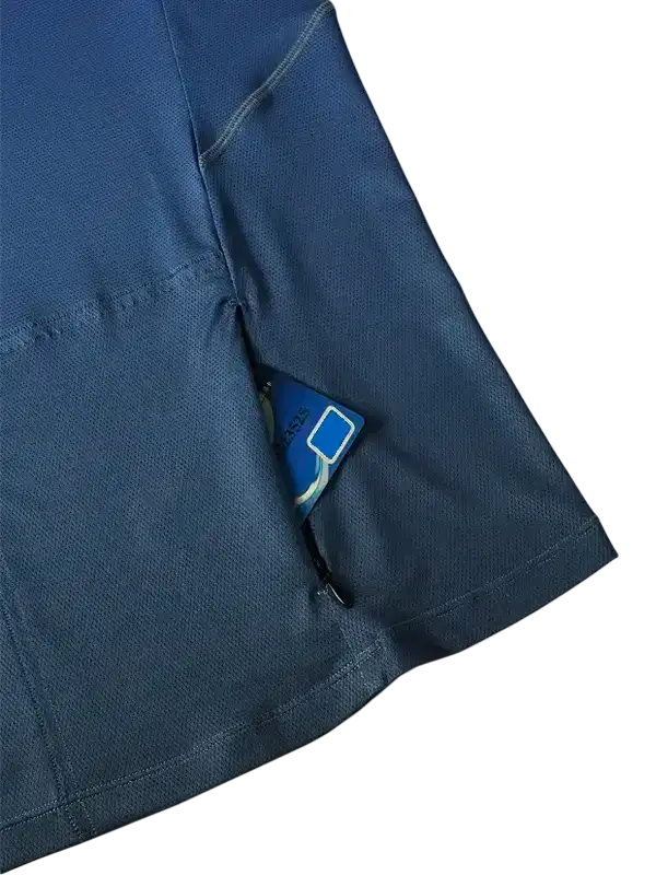 Blue cycling jersey pocket holding card, breathable fabric, secure storage for rides