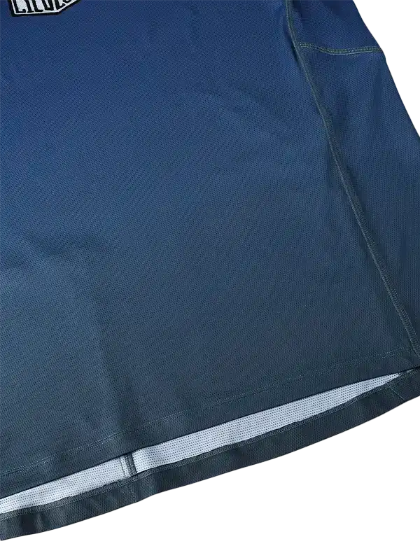 Navy blue cycling jersey with mesh panel and reflective trim for breathable performance wear