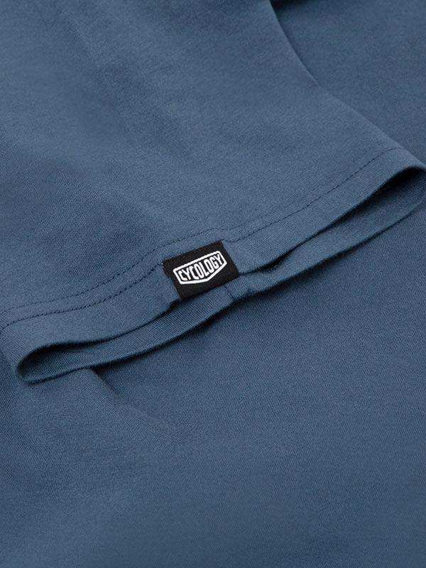 Blue cycling jersey with Cycology brand tag, showcasing high-quality fabric and design detail