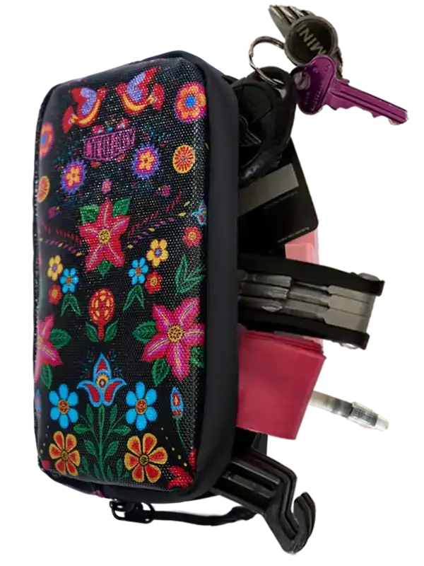 Floral-patterned cycling accessory bag with keys and tools attached