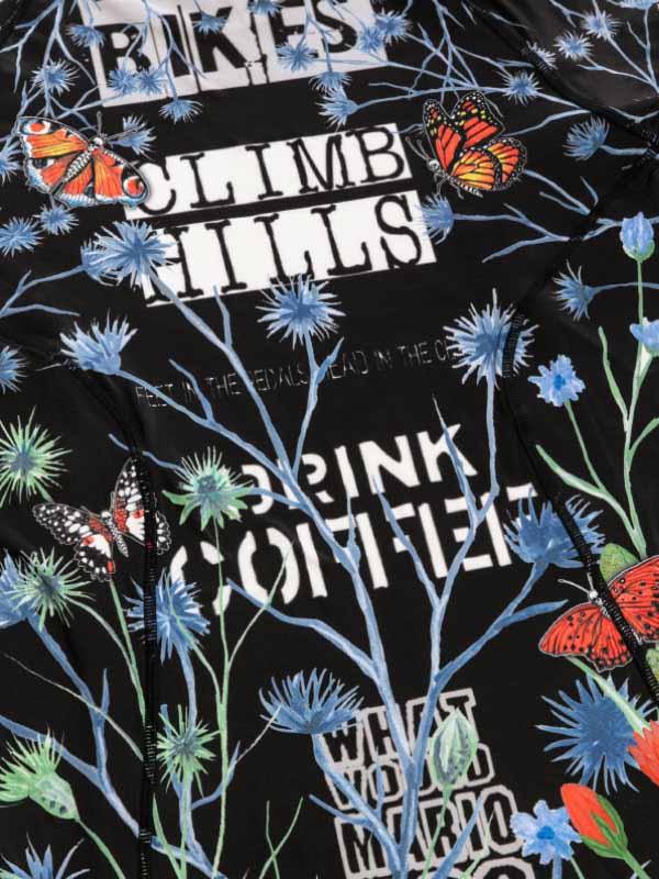 Black cycling jersey with 'CLIMB HILLS' text, butterflies, and blue floral print design