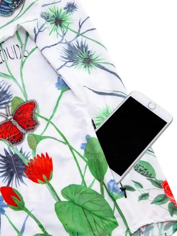 Floral cycling jersey with butterfly print, phone pocket detail, vibrant botanical design for women's bike wear