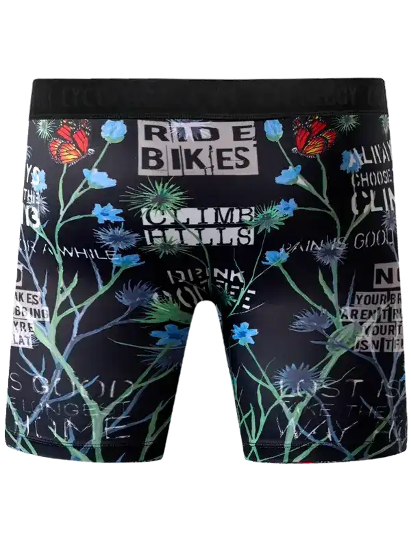 Men's cycling shorts with floral and butterfly print, motivational cycling phrases on black background