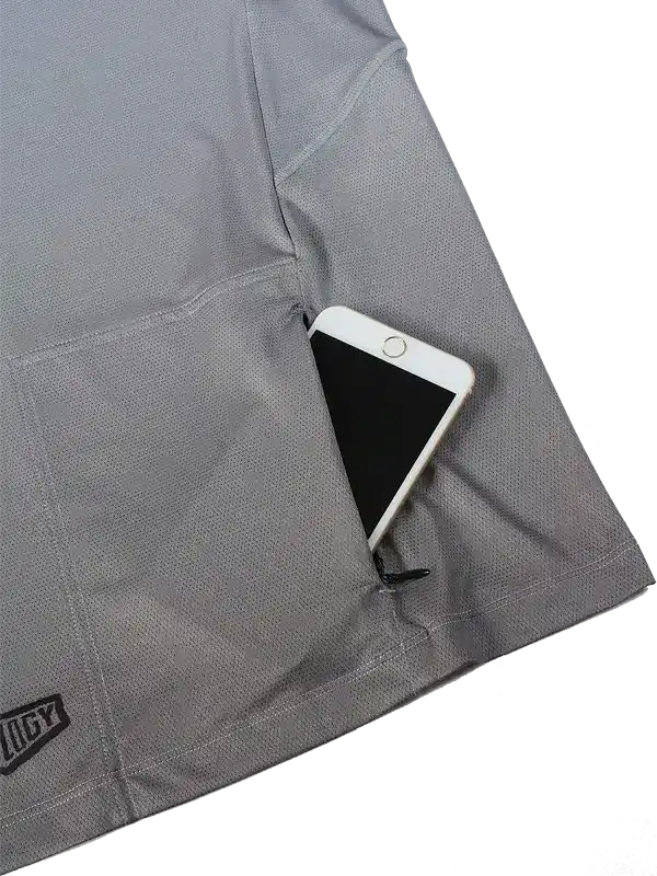 Gray cycling jersey pocket holding a smartphone, showcasing storage functionality for riders.