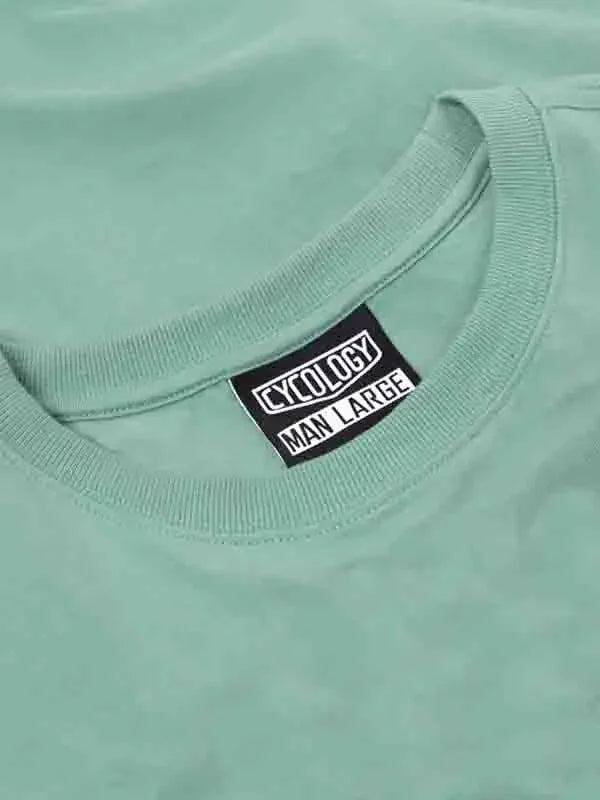 Mint green men's cycling t-shirt with Cycology brand tag, size large, soft fabric detail