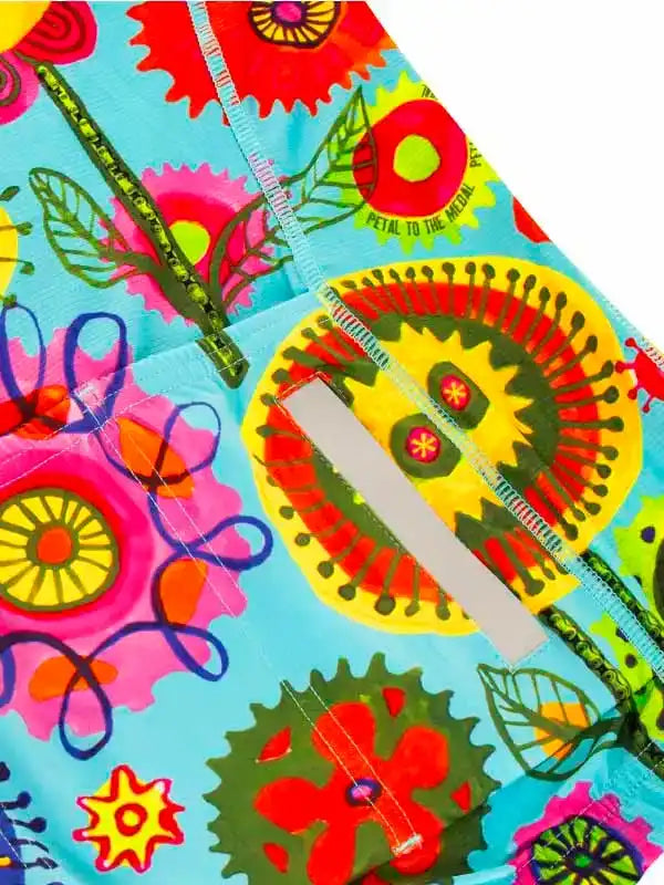 Vibrant floral cycling shorts with bold patterns and reflective strip for safety and style