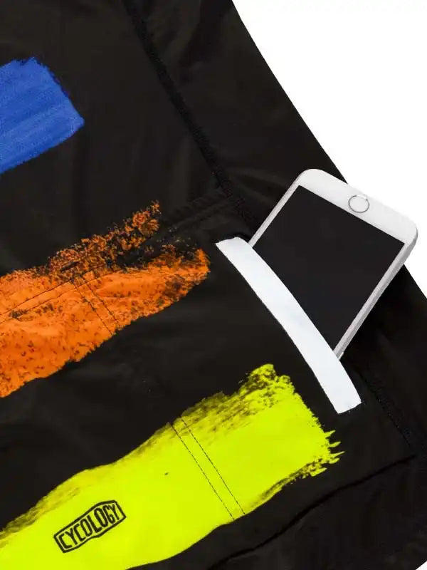 Black cycling jersey with bold brushstroke print in blue, orange, neon yellow; phone in rear pocket