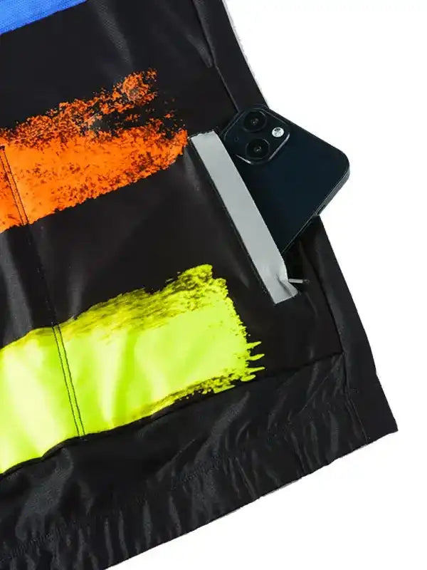 Black cycling jersey with neon orange and yellow brushstroke design, phone in back pocket