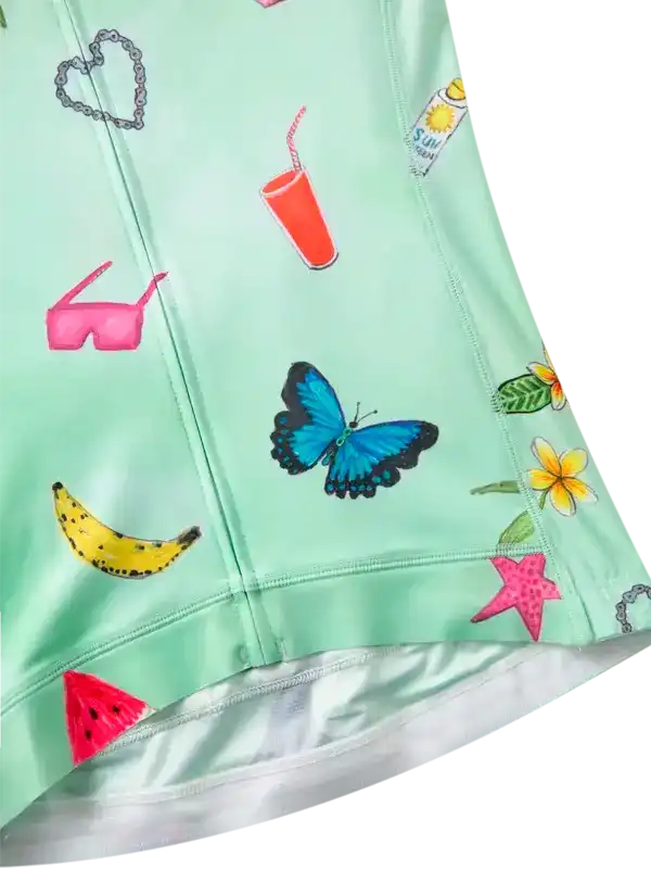 Mint green women's cycling jersey with butterfly, banana, sunglasses, and flower print design