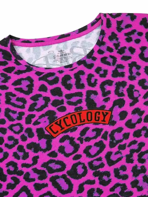 Pink leopard print cycling jersey with bold 'CYCOLOGY' logo, vibrant design for women's bike wear
