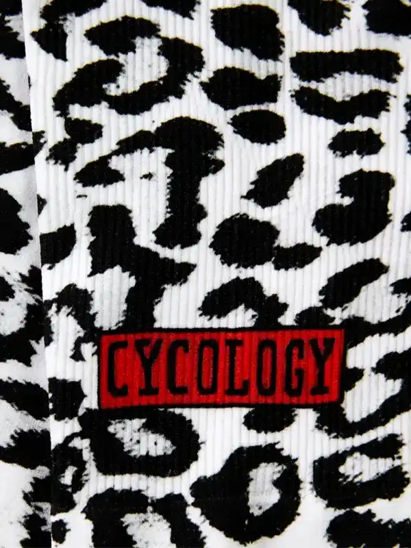 Cycology leopard print cycling apparel with bold red logo detail