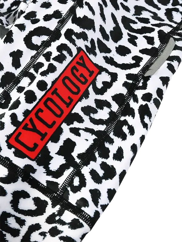 Cycling shorts with bold leopard print and red Cycology logo, designed for performance and style.