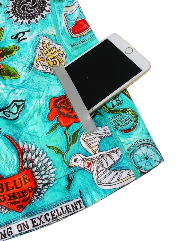 Colorful cycling shorts with floral and tattoo-style graphics, featuring phone pocket for riders.