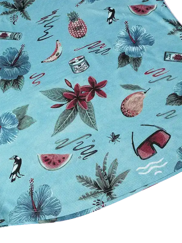 Tropical print cycling jersey with hibiscus, pineapple, watermelon, and sunglasses on light blue fabric