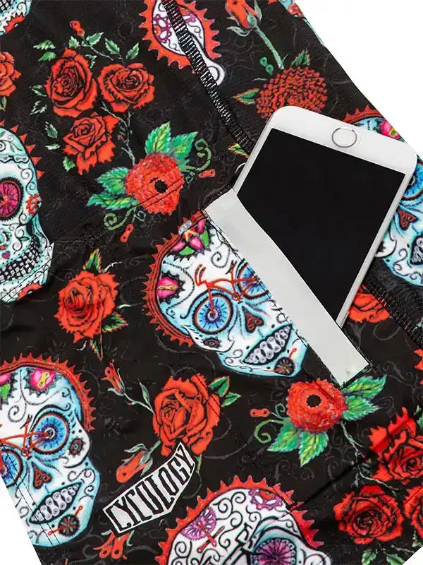 Cycling shorts with sugar skull and rose print, featuring phone pocket and brand logo