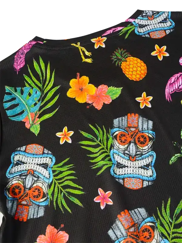Black cycling jersey with tropical tiki, pineapple, and hibiscus print for men and women