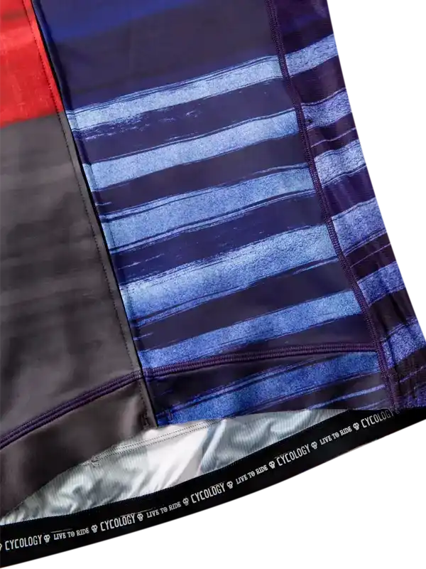 Cycling shorts with blue striped design, black panel, and 'CYCOLOGY LIVE TO RIDE' waistband