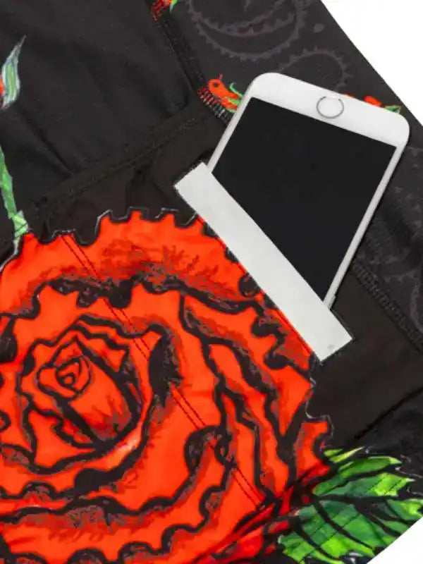 Cycling shorts with bold red rose print and phone pocket, ideal for men's and women's rides