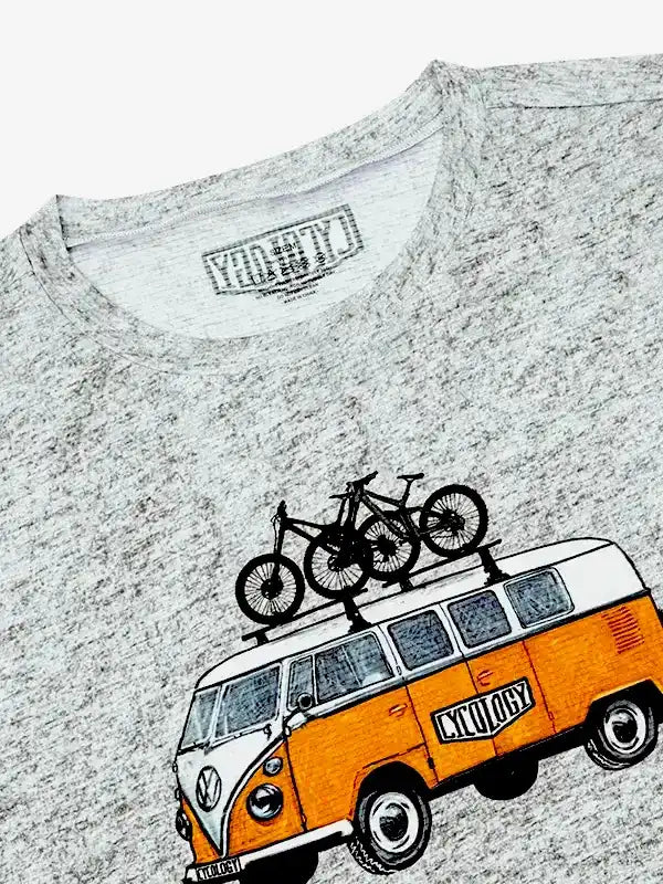Grey cycling t-shirt with vintage van graphic carrying mountain bikes, featuring retro design for bike lovers