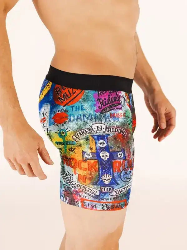 Men's colorful graphic cycling shorts with bold rock-inspired prints and black waistband