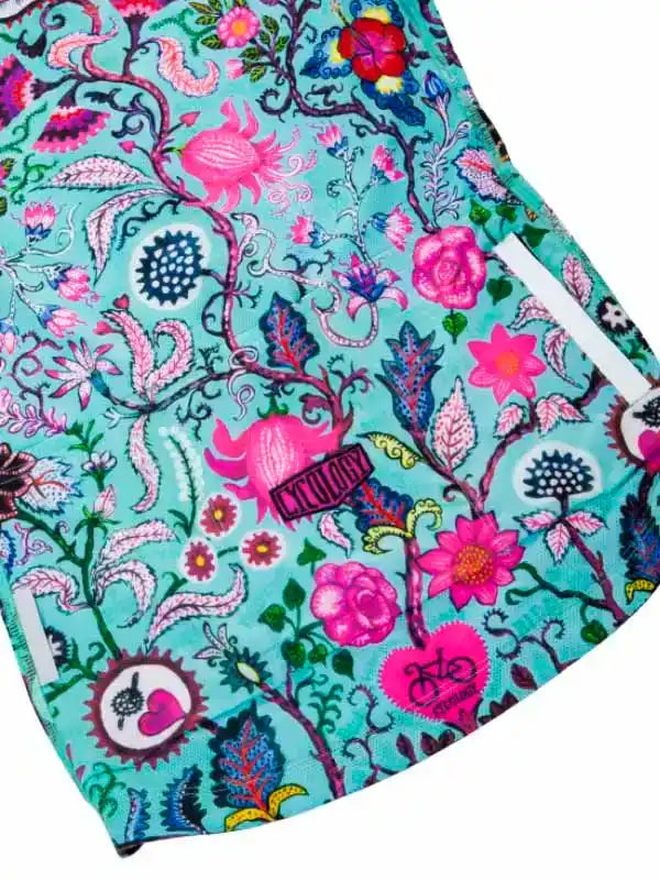 Vibrant floral cycling shorts with pink and teal botanical print, ideal for women's bike rides