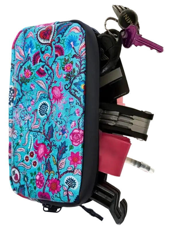 Floral-patterned bike tool bag with keys and multi-tool, ideal for cyclists needing compact storage on rides.