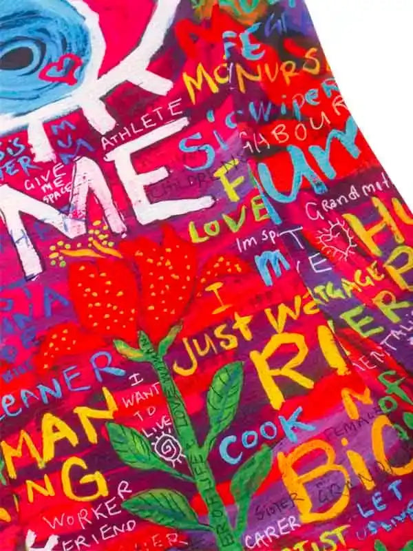 Vibrant cycling jersey with colorful graffiti-style text and floral design, perfect for women's bike wear.