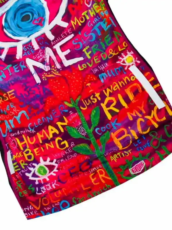 Vibrant women's cycling jersey with colorful graffiti-style text and art, featuring words like 'RIDE MY BIKE' and 'HUMAN BEING'
