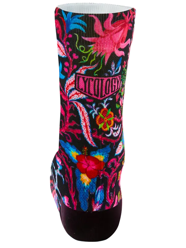 Colorful sock with floral design and brand logo on a black background