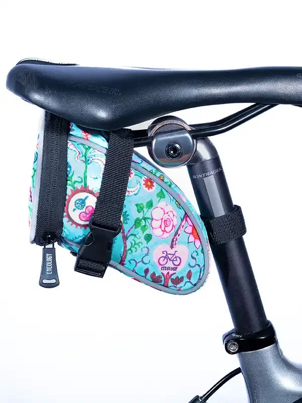 Colorful floral bike saddle bag with secure straps, perfect for cycling essentials