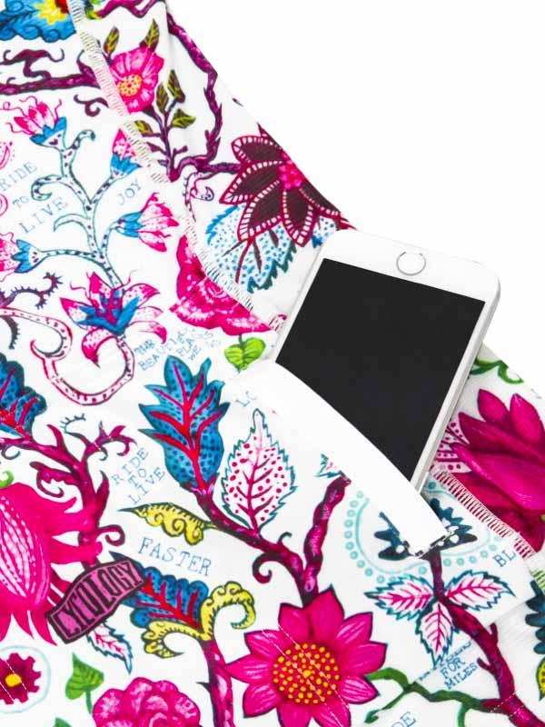 Colorful floral cycling shorts with phone pocket, vibrant pink blue print, ride faster design