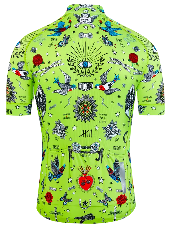 Green cycling jersey with colorful tattoos and symbols on a white background