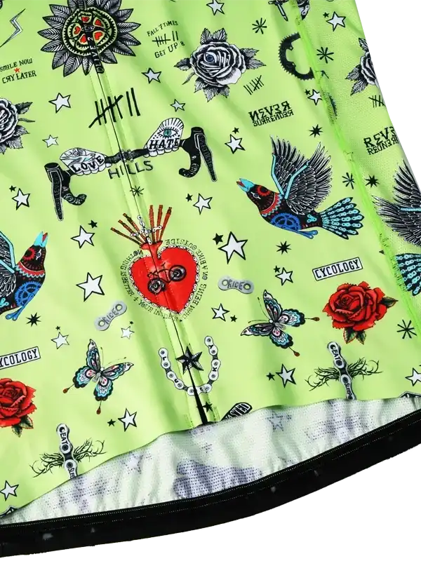 Vibrant green cycling jersey with tattoo-style graphics, roses, birds, stars, and bold designs for men and women.