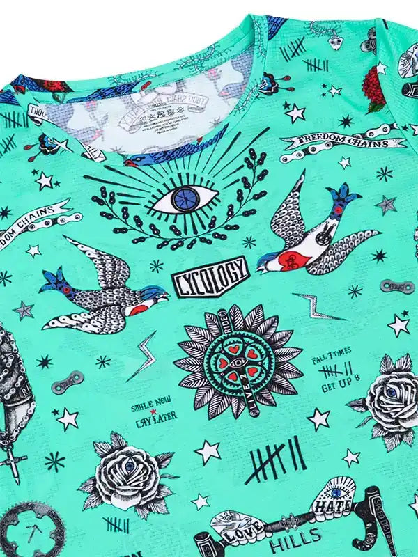 Mint green cycling jersey with tattoo-style graphics, birds, roses, and eye design for men and women