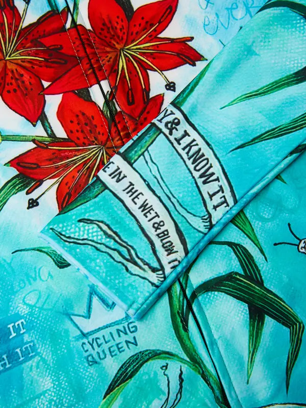 Cycling jersey with long sleeves and a floral design on a aqua background