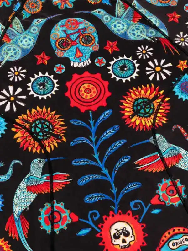 Vibrant cycling jersey with hummingbirds, skulls, and floral gears on black fabric