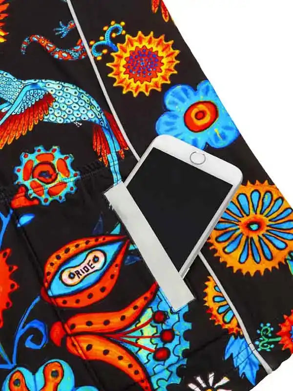 Vibrant floral and dragon print cycling shorts with phone pocket, featuring bold orange, blue, and black patterns.